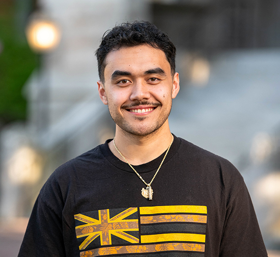 A woman leans against a railing